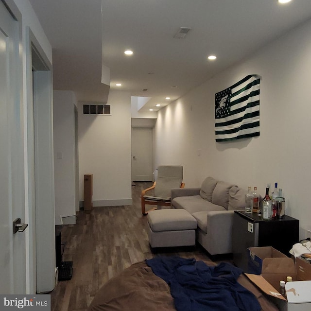 living room with dark hardwood / wood-style floors