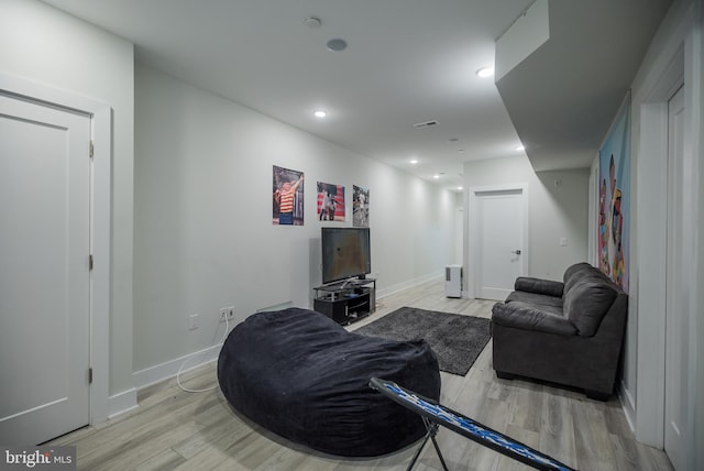 living room with light hardwood / wood-style flooring