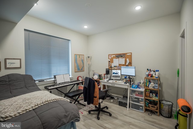 bedroom with light wood-type flooring