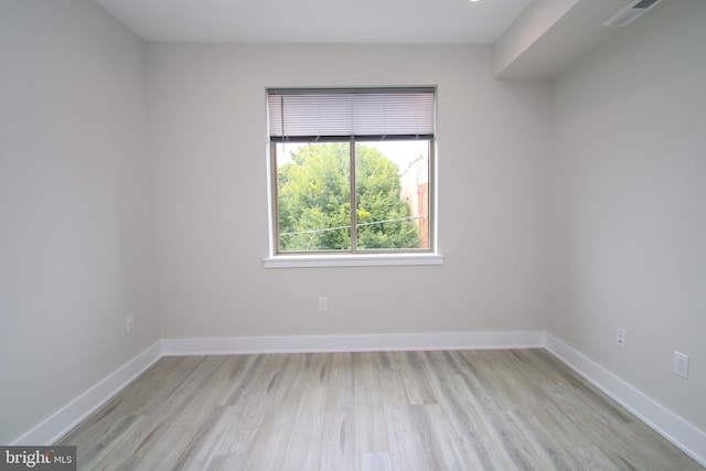 empty room with light hardwood / wood-style floors