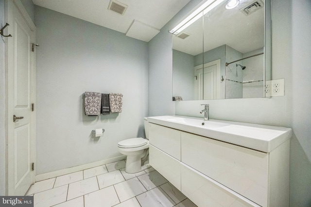 bathroom featuring vanity, toilet, and a shower