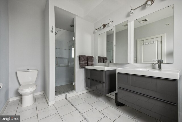 bathroom with walk in shower, toilet, and vanity