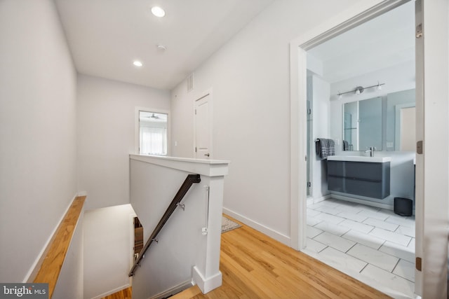 corridor featuring light hardwood / wood-style floors