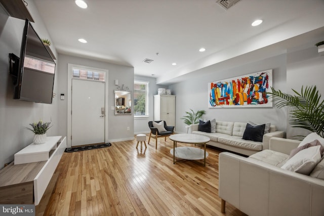 living room with light hardwood / wood-style flooring