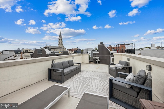 view of patio with an outdoor living space and a balcony