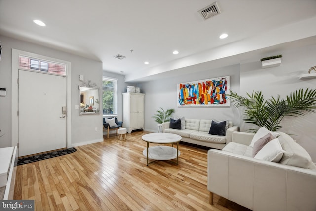 living room with light hardwood / wood-style flooring