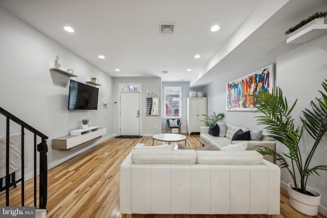 living room with light hardwood / wood-style floors