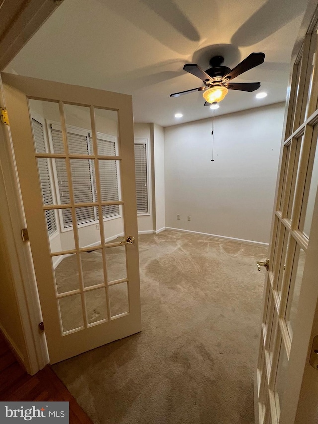 interior space featuring ceiling fan and french doors