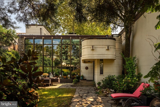 exterior space with a balcony and a patio