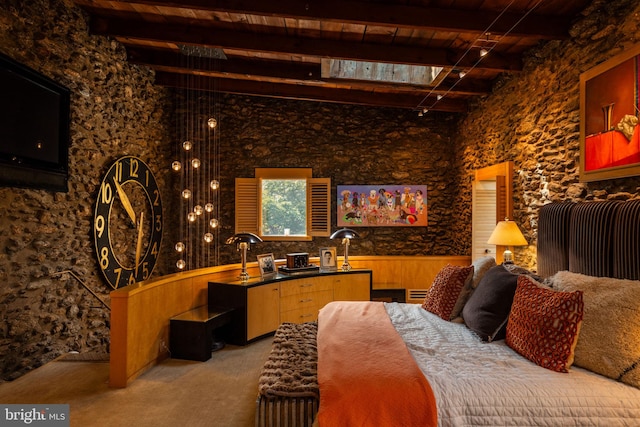 bedroom featuring wood ceiling, beamed ceiling, wooden walls, and light colored carpet