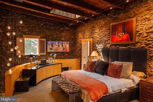 bedroom featuring beamed ceiling and wooden ceiling