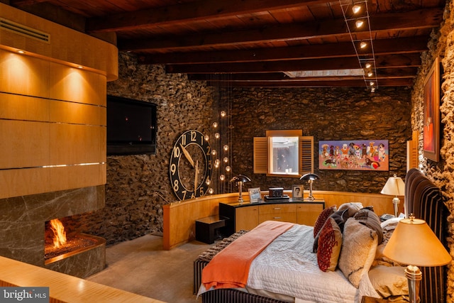 bedroom featuring beamed ceiling and wood ceiling