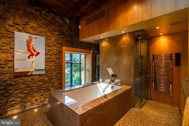 bathroom featuring beam ceiling, plus walk in shower, radiator heating unit, and wooden ceiling