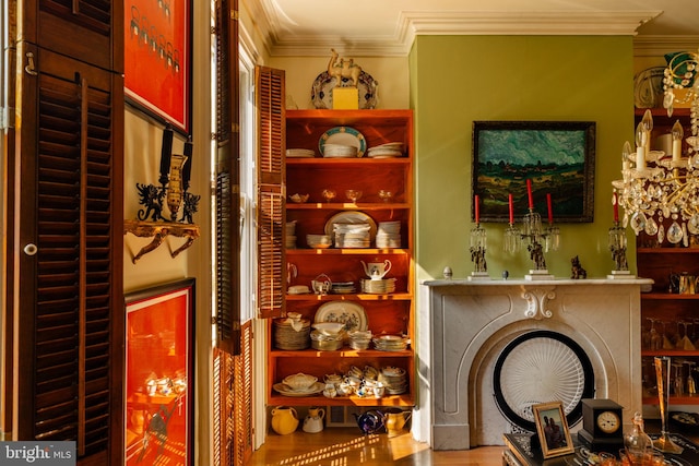 bar featuring hardwood / wood-style floors and crown molding