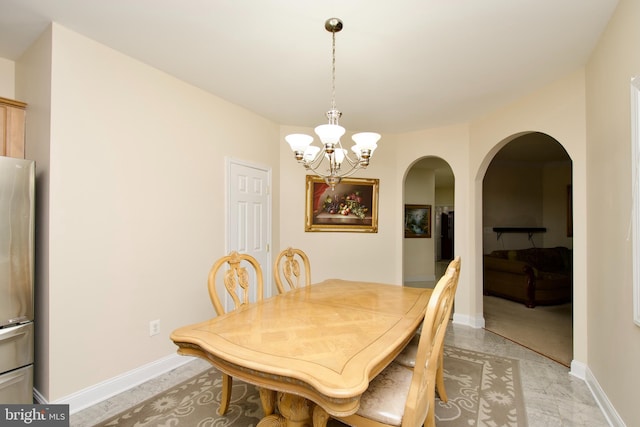 dining space with a chandelier