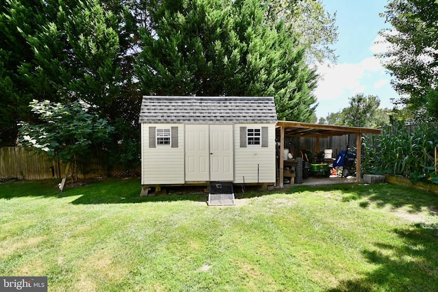 view of outbuilding featuring a lawn