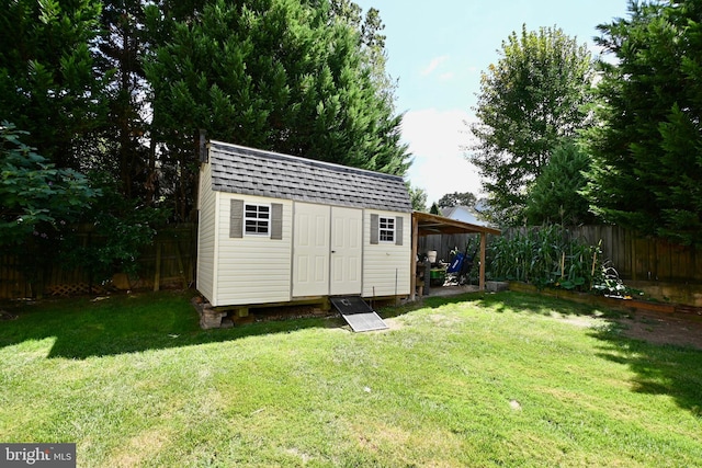 view of outbuilding with a lawn