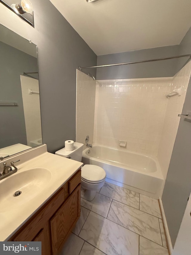 full bathroom with toilet, marble finish floor, vanity, and washtub / shower combination