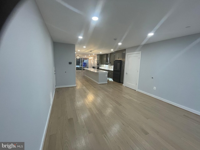 unfurnished living room featuring light hardwood / wood-style floors