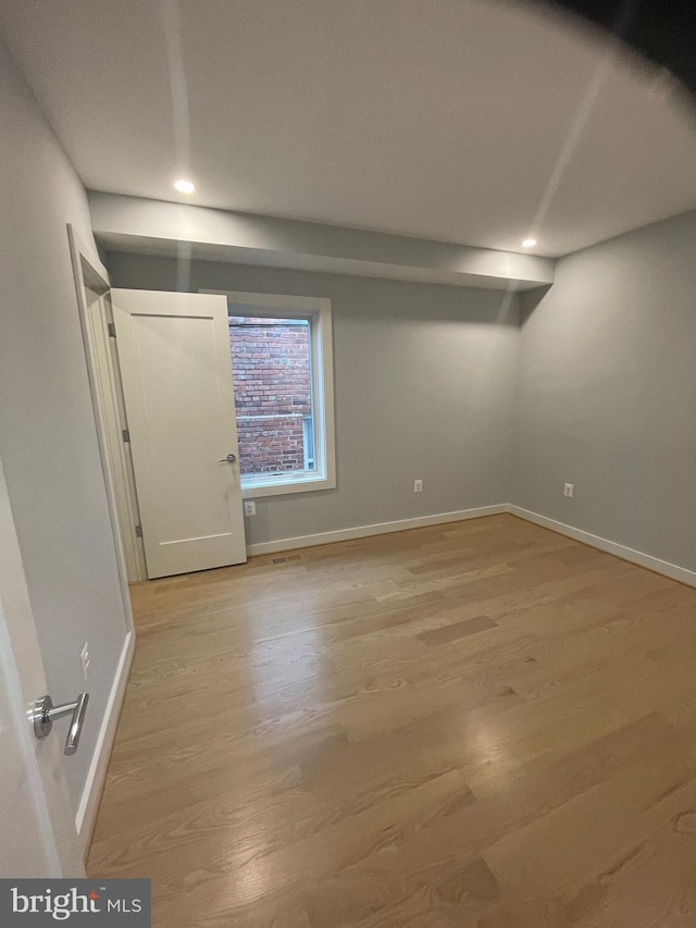 empty room featuring hardwood / wood-style floors