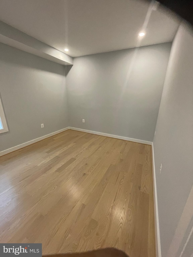 spare room with hardwood / wood-style floors