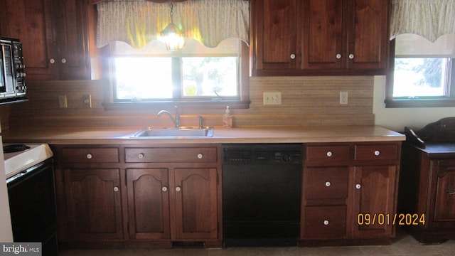 kitchen featuring dishwasher, white range with electric cooktop, and sink