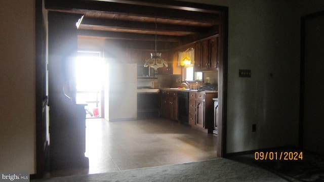 kitchen featuring dishwasher, beamed ceiling, sink, and hanging light fixtures