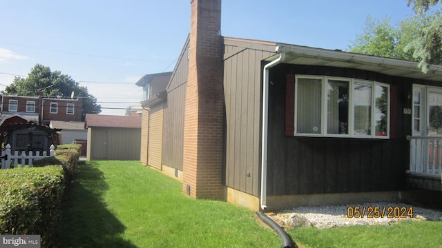 view of home's exterior with a yard