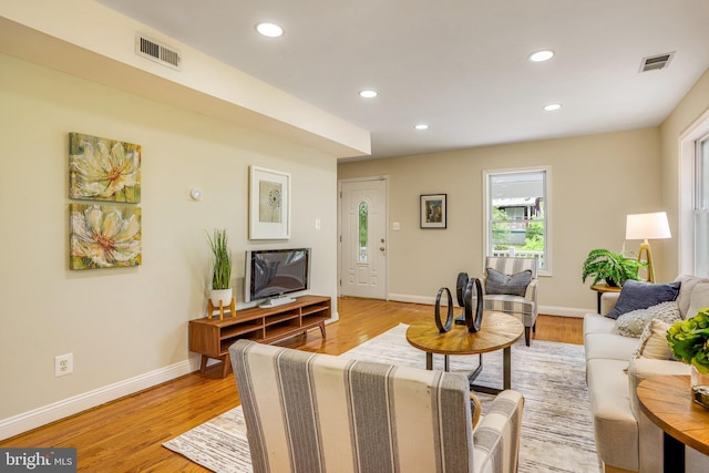 living room with light hardwood / wood-style floors