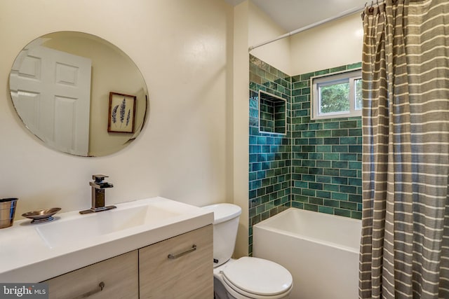 full bathroom featuring toilet, shower / tub combo, and vanity