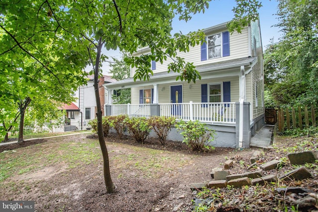 view of front of property featuring covered porch