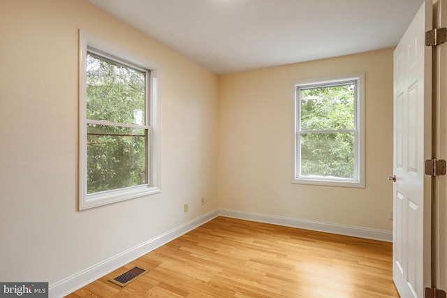 unfurnished room featuring light hardwood / wood-style flooring