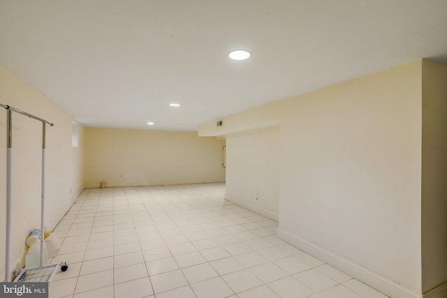 unfurnished room featuring light tile patterned floors