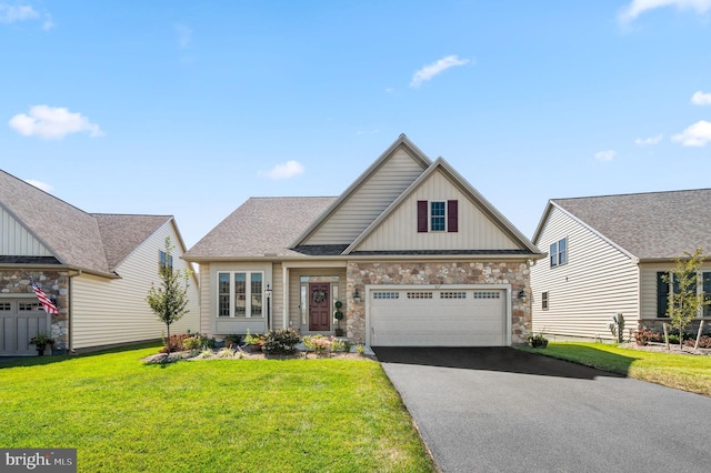 view of front of home featuring a garage and a front lawn