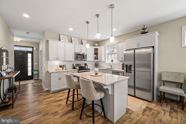 dining area with an inviting chandelier and dark hardwood / wood-style flooring