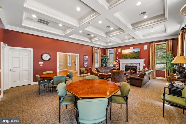 carpeted dining room featuring coffered ceiling, a stone fireplace, beamed ceiling, and ornamental molding