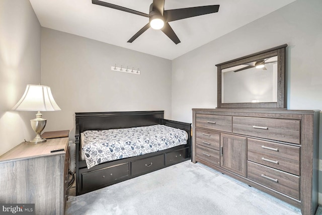 carpeted bedroom featuring ceiling fan