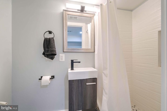 bathroom with vanity and walk in shower