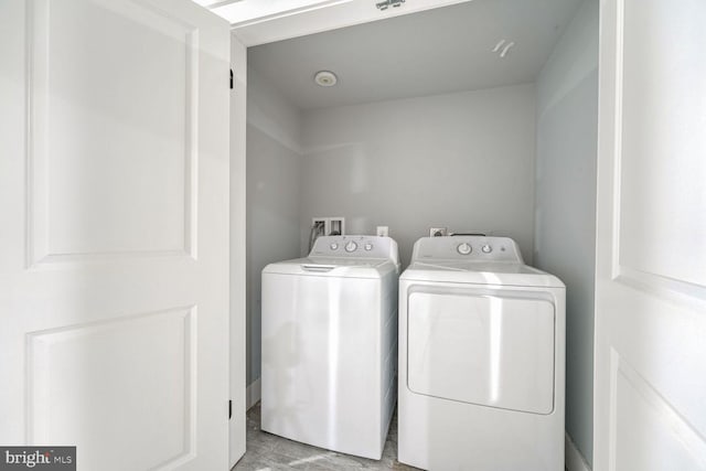 washroom with separate washer and dryer