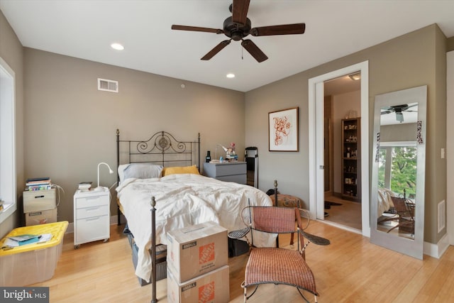 bedroom featuring ceiling fan and light hardwood / wood-style floors