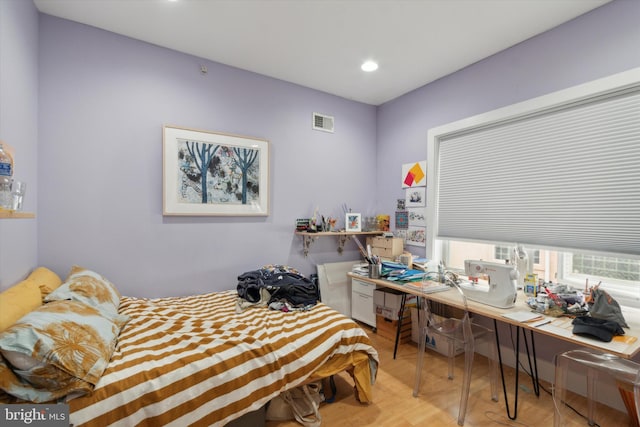 bedroom with light hardwood / wood-style floors