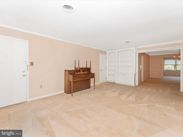 empty room with crown molding, a notable chandelier, and light carpet