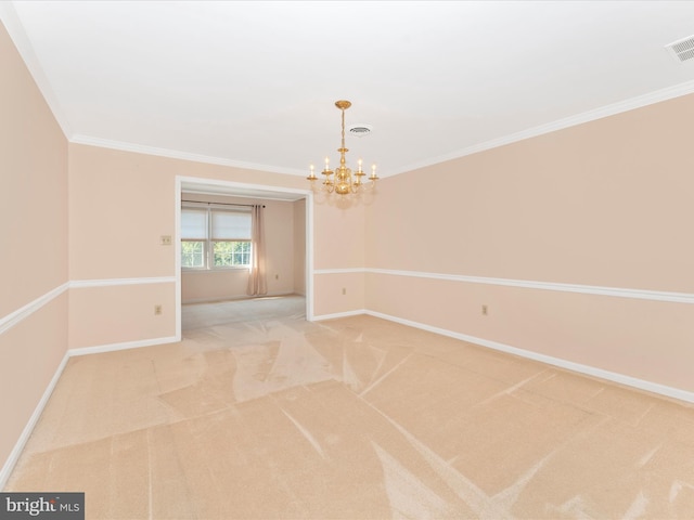 empty room featuring light carpet, ornamental molding, and a notable chandelier