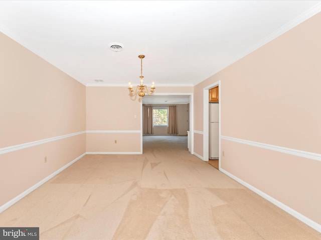 carpeted spare room featuring crown molding and a chandelier