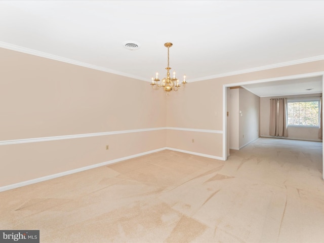 spare room featuring crown molding, an inviting chandelier, and light carpet