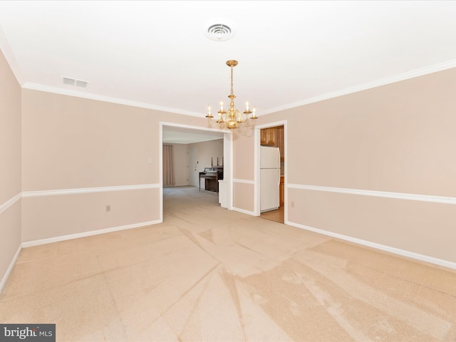 spare room featuring crown molding, a chandelier, and carpet floors