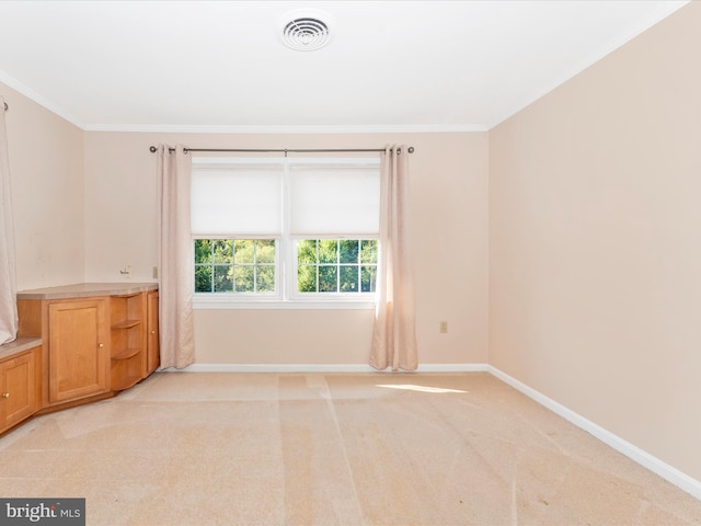 carpeted empty room with ornamental molding