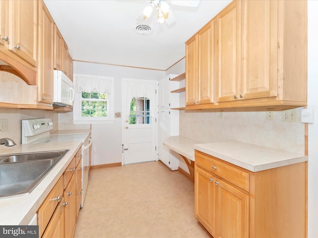 kitchen with white appliances, sink, and ceiling fan