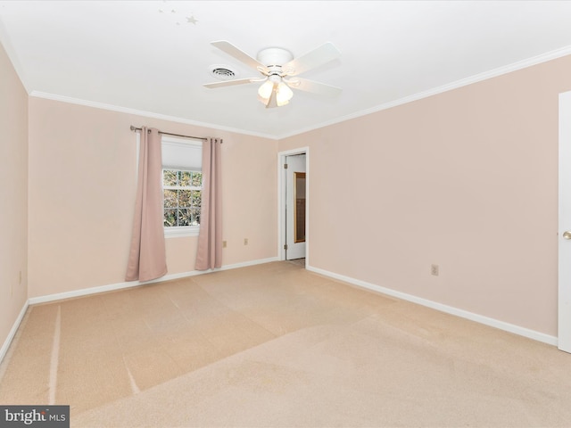 carpeted empty room with ornamental molding and ceiling fan