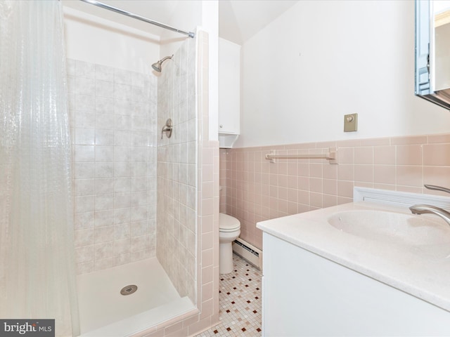 bathroom featuring tile patterned flooring, toilet, a shower with curtain, a baseboard radiator, and vanity